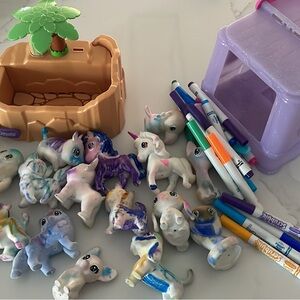 Scribble ScrubbiesColorful Animal Figurines, tub, and markers.